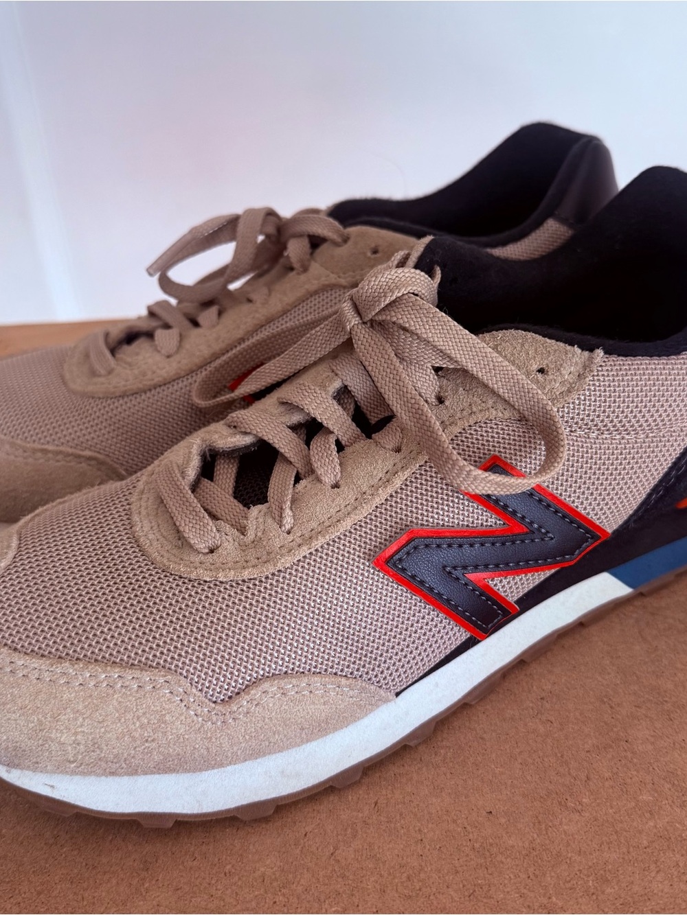 New Balance Men’s Beige and Black Athletic Sneakers with Red Accent